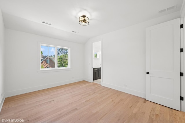 900 Pleasant Ln, Glenview, IL 60025 - empty room with light wood finished floors and lofted ceiling
