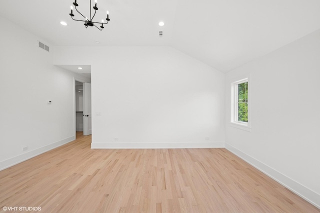 900 Pleasant Ln, Glenview, IL 60025 - spare room with a chandelier, light wood-style flooring, vaulted ceiling, and recessed lighting