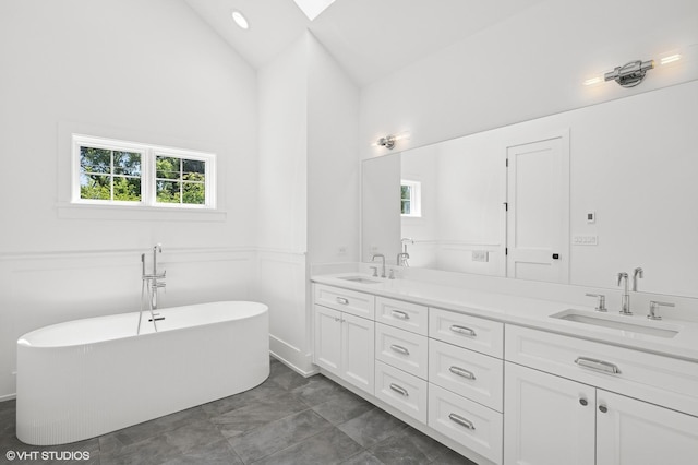 900 Pleasant Ln, Glenview, IL 60025 - full bath featuring double vanity, plenty of natural light, a freestanding bath, high vaulted ceiling, and a skylight