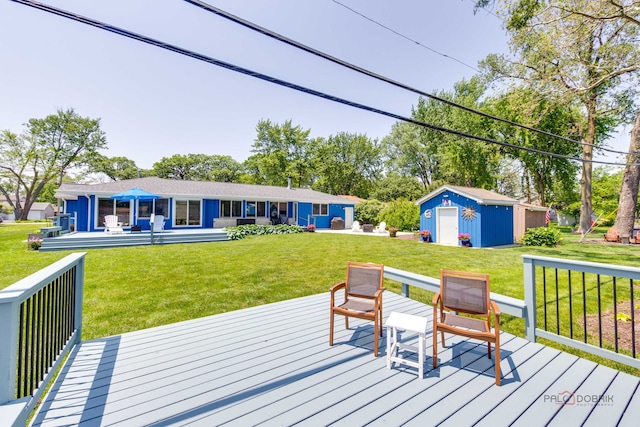 908 Jackson Ave, Wauconda, IL 60084 - wooden deck with an outdoor structure and a lawn