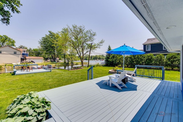 908 Jackson Ave, Wauconda, IL 60084 - wooden deck featuring a water view, a lawn, and outdoor dining area