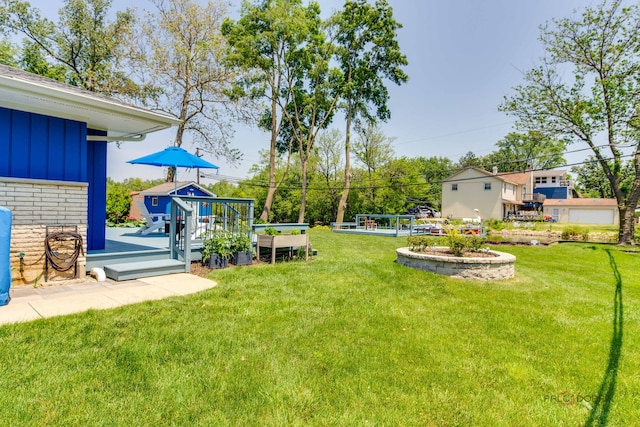 908 Jackson Ave, Wauconda, IL 60084 - view of green lawn featuring a wooden deck