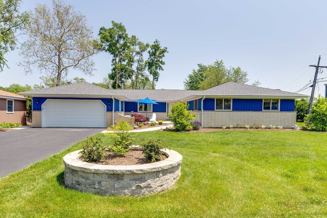 908 Jackson Ave, Wauconda, IL 60084 - ranch-style home featuring brick siding, a garage, asphalt driveway, a front yard, and roof with shingles