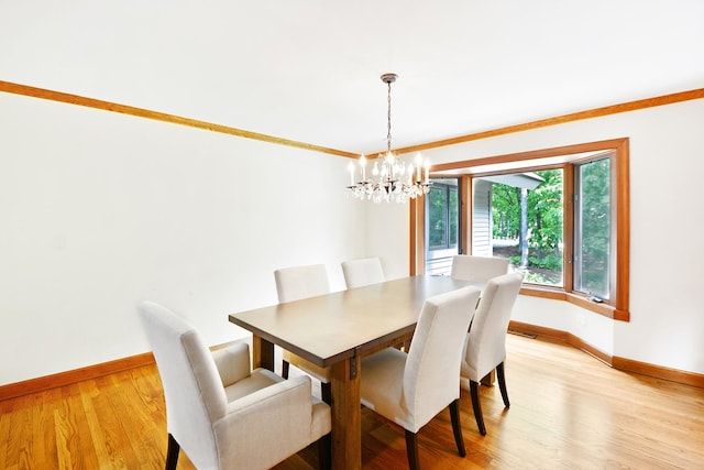 24 Robin Crest Rd, Hawthorn Woods, IL 60047 - dining area featuring a chandelier, light wood-style flooring, and ornamental molding
