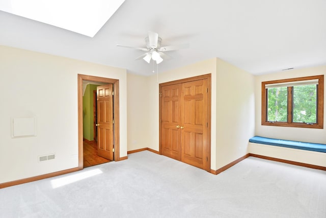 24 Robin Crest Rd, Hawthorn Woods, IL 60047 - unfurnished bedroom featuring carpet, a closet, a skylight, and a ceiling fan