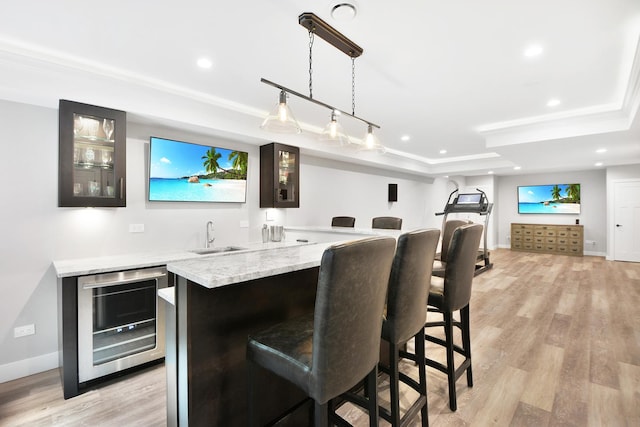 24 Robin Crest Rd, Hawthorn Woods, IL 60047 - indoor wet bar with beverage cooler, light wood-type flooring, a raised ceiling, recessed lighting, and decorative light fixtures
