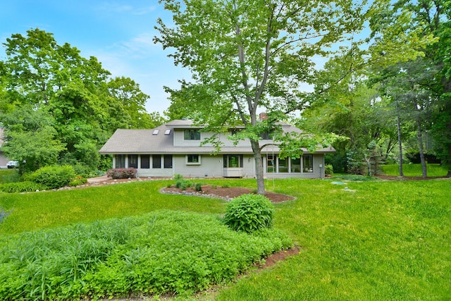 24 Robin Crest Rd, Hawthorn Woods, IL 60047 - rear view of property featuring a lawn and a chimney