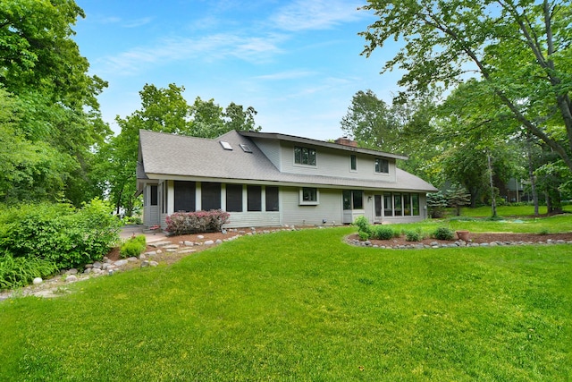 24 Robin Crest Rd, Hawthorn Woods, IL 60047 - view of front of home with a front yard, a chimney, and a sunroom
