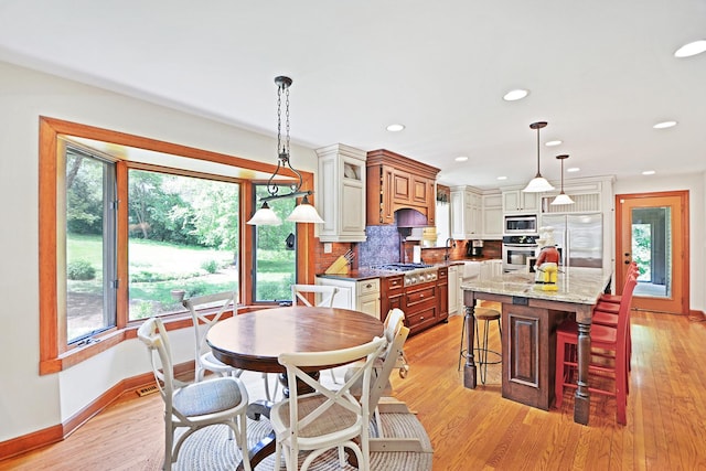 24 Robin Crest Rd, Hawthorn Woods, IL 60047 - dining space featuring light wood-type flooring and recessed lighting