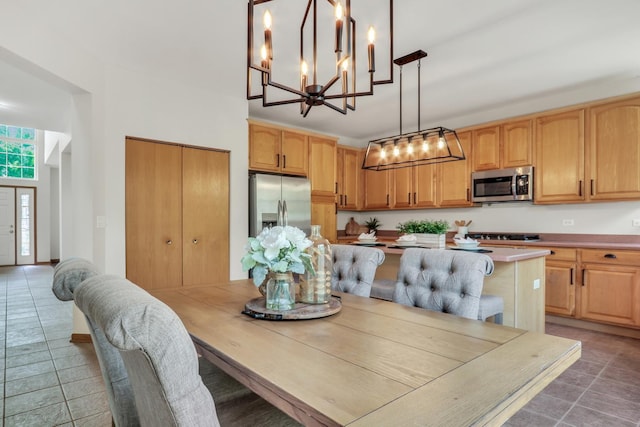 34405 N Bobolink Trl, Grayslake, IL 60030 - dining room with light tile patterned floors and a chandelier