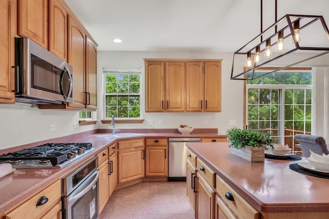 34405 N Bobolink Trl, Grayslake, IL 60030 - kitchen with stainless steel appliances, light brown cabinetry, hanging light fixtures, light tile patterned floors, and recessed lighting