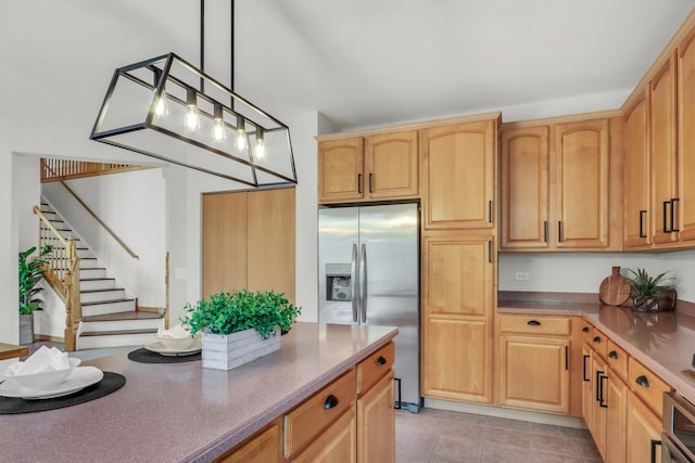 34405 N Bobolink Trl, Grayslake, IL 60030 - kitchen featuring appliances with stainless steel finishes, light brown cabinets, pendant lighting, and light tile patterned floors