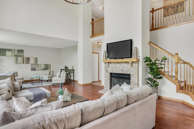 34405 N Bobolink Trl, Grayslake, IL 60030 - living area with a towering ceiling, wood finished floors, stairway, and a fireplace