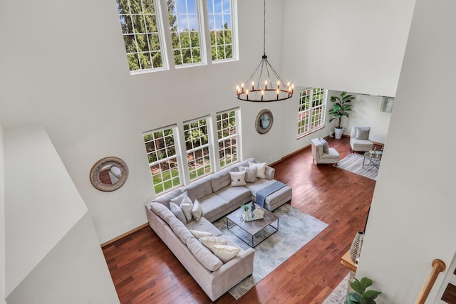 34405 N Bobolink Trl, Grayslake, IL 60030 - living room featuring a chandelier, a towering ceiling, plenty of natural light, and wood finished floors