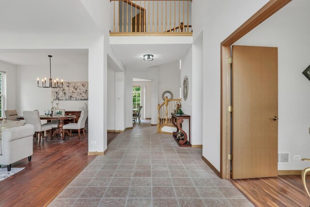 34405 N Bobolink Trl, Grayslake, IL 60030 - entrance foyer with a chandelier, a towering ceiling, and wood finished floors