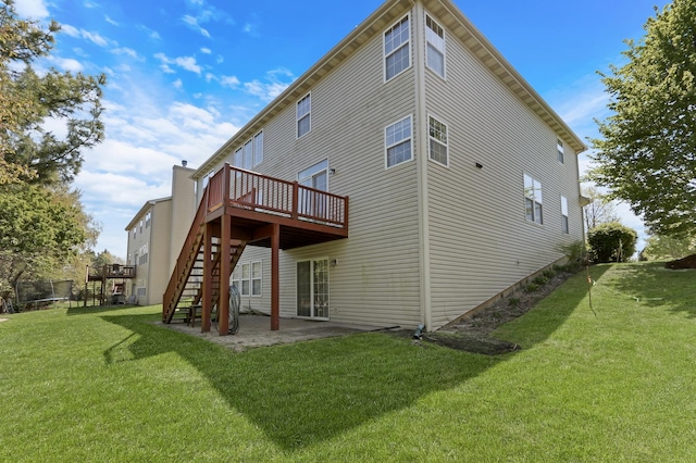 34405 N Bobolink Trl, Grayslake, IL 60030 - back of property featuring a deck, stairs, a yard, and a patio area