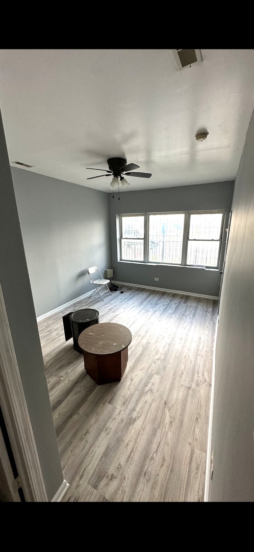 4226 W Ogden, Chicago, IL 60623 - spare room featuring wood finished floors, plenty of natural light, and ceiling fan