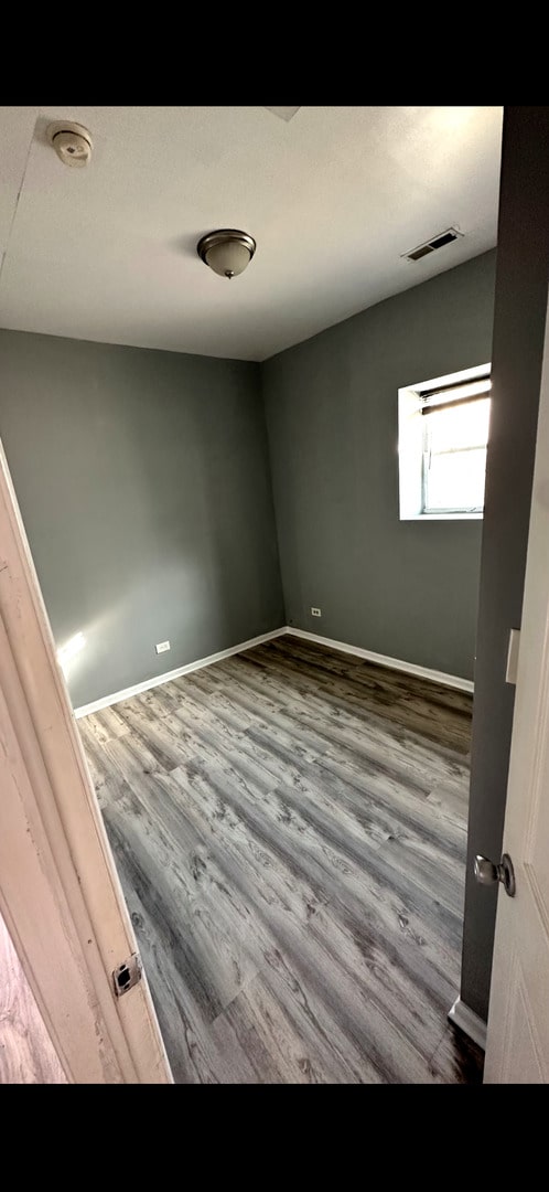 4226 W Ogden, Chicago, IL 60623 - empty room featuring wood finished floors and a smoke detector