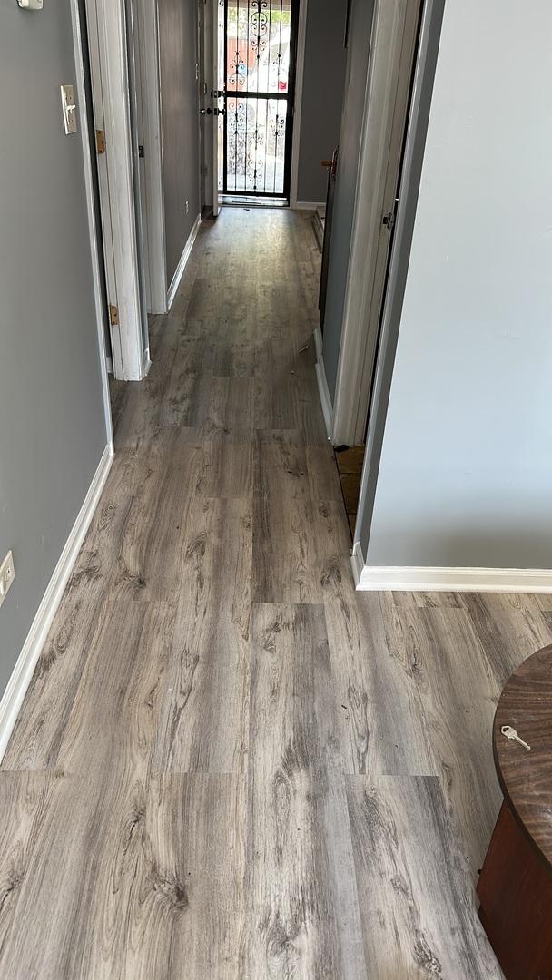 4226 W Ogden, Chicago, IL 60623 - corridor featuring wood finished floors and baseboards