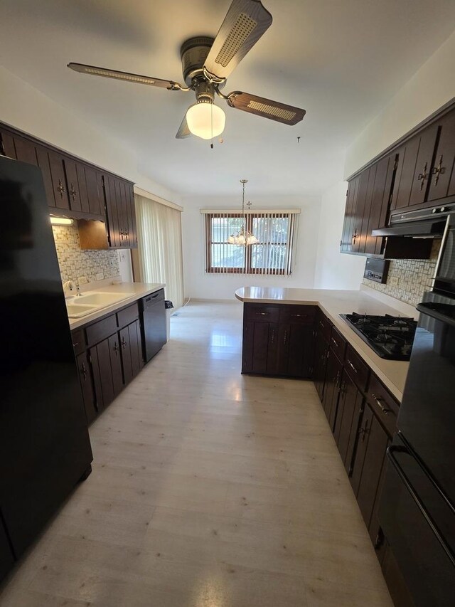 7725 Sawyer Rd, Darien, IL 60561 - kitchen with black appliances, a chandelier, backsplash, and a peninsula