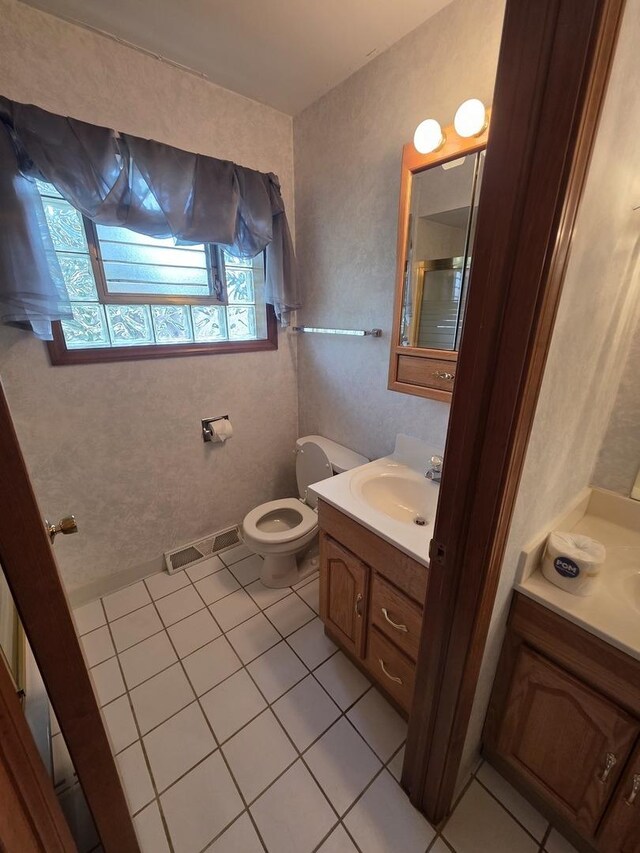 7725 Sawyer Rd, Darien, IL 60561 - bathroom with vanity and tile patterned floors