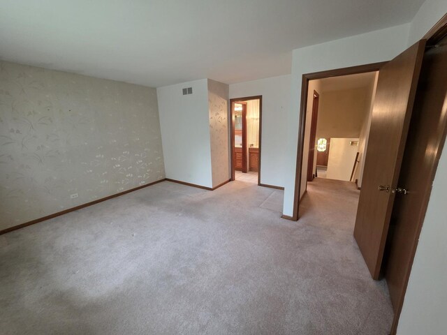 7725 Sawyer Rd, Darien, IL 60561 - unfurnished bedroom with carpet and wallpapered walls