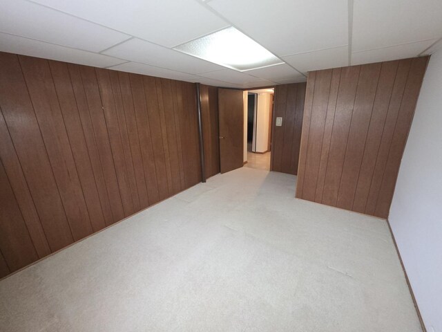 7725 Sawyer Rd, Darien, IL 60561 - finished below grade area with carpet floors, wood walls, and a paneled ceiling
