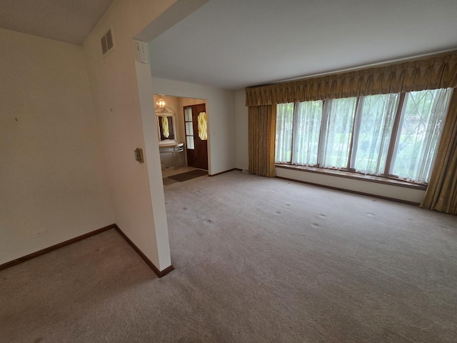 7725 Sawyer Rd, Darien, IL 60561 - spare room featuring light colored carpet and baseboard heating