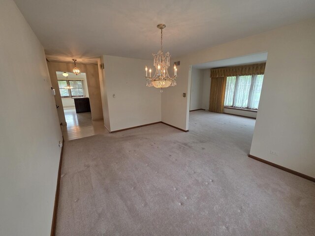 7725 Sawyer Rd, Darien, IL 60561 - unfurnished dining area featuring a chandelier and carpet flooring
