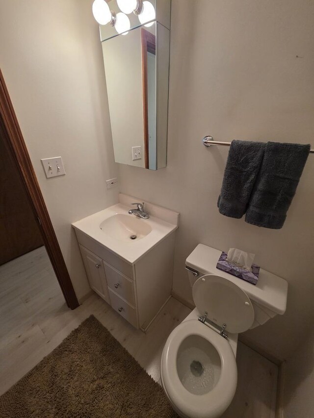7725 Sawyer Rd, Darien, IL 60561 - bathroom with vanity and wood finished floors