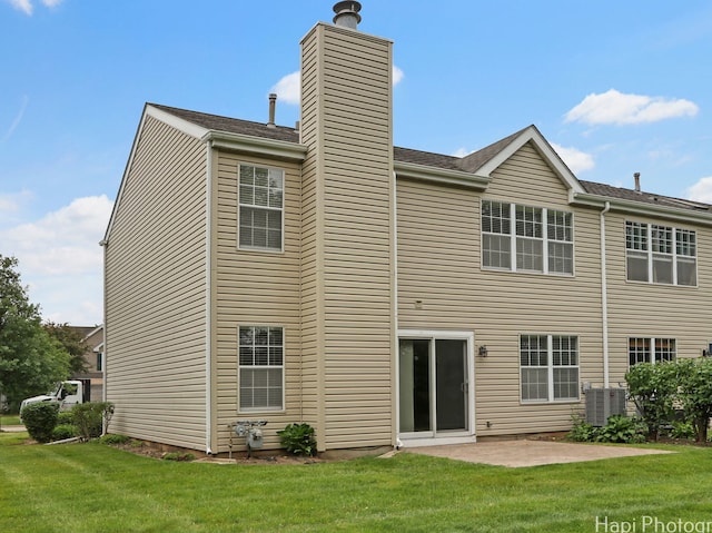 690 Savannah Ln, Crystal Lake, IL 60014 - rear view of property featuring a chimney, a patio area, and a yard