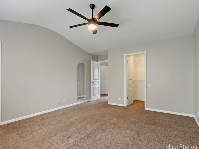690 Savannah Ln, Crystal Lake, IL 60014 - unfurnished bedroom with lofted ceiling, carpet flooring, a walk in closet, a ceiling fan, and a closet