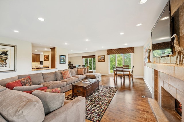 1740 Mission Hills Rd Unit 304, Northbrook, IL 60062 - living room with a lit fireplace, light wood-style flooring, and recessed lighting
