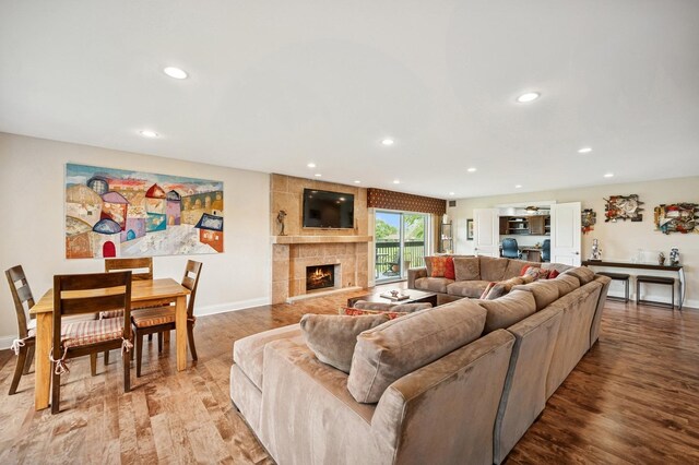 1740 Mission Hills Rd Unit 304, Northbrook, IL 60062 - living area featuring recessed lighting, a tile fireplace, and wood finished floors