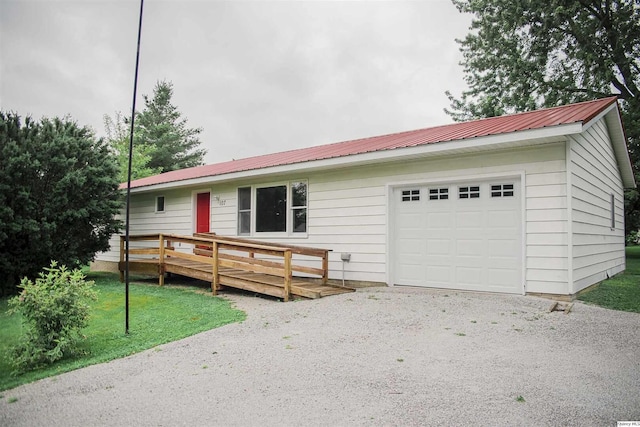 107 N First St, West Point, IL 62380 - ranch-style home with a metal roof, a deck, and a garage