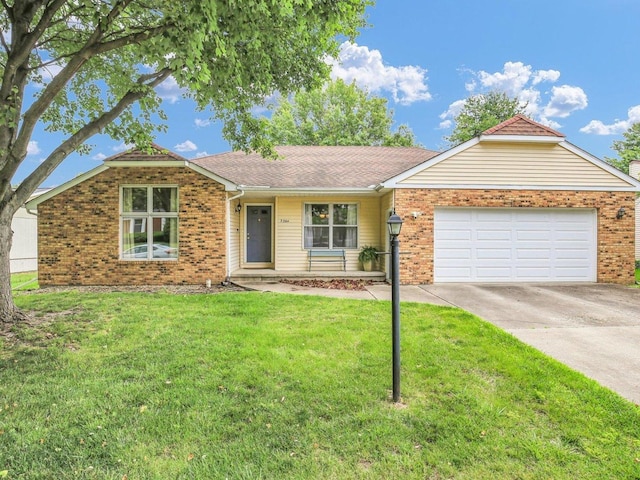 3204 Fawn Hill Ct, Urbana, IL 61802 - ranch-style home with driveway, a garage, brick siding, and a front yard