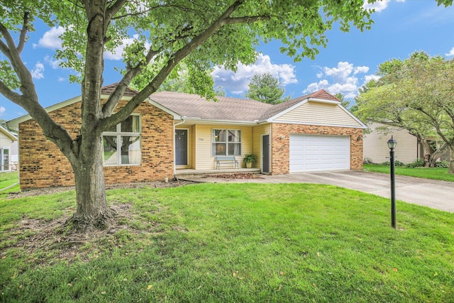 3204 Fawn Hill Ct, Urbana, IL 61802 - view of front of home with brick siding, an attached garage, concrete driveway, and a front yard