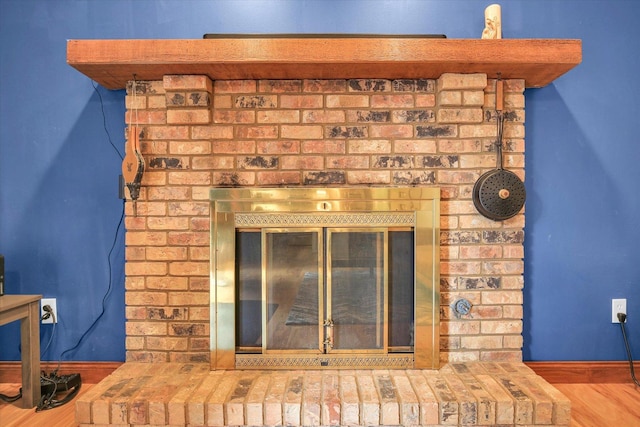 3204 Fawn Hill Ct, Urbana, IL 61802 - detailed view of a brick fireplace and wood finished floors