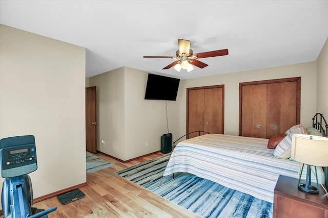 3204 Fawn Hill Ct, Urbana, IL 61802 - bedroom featuring wood finished floors, multiple closets, and a ceiling fan