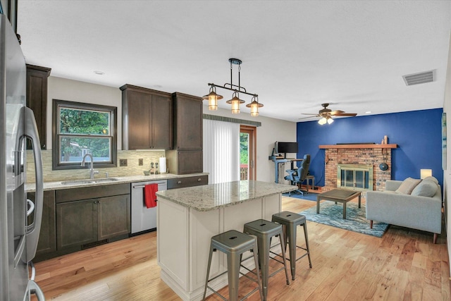 3204 Fawn Hill Ct, Urbana, IL 61802 - kitchen with stainless steel appliances, dark brown cabinets, plenty of natural light, light wood finished floors, and recessed lighting