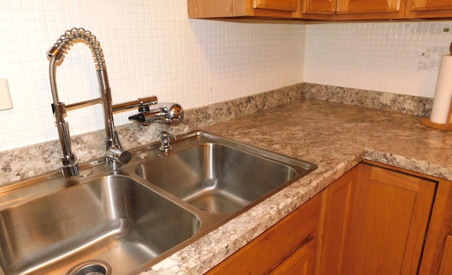9740 S Pulaski Rd Unit 107, Oak Lawn, IL 60453 - kitchen featuring brown cabinets, tasteful backsplash, and light countertops