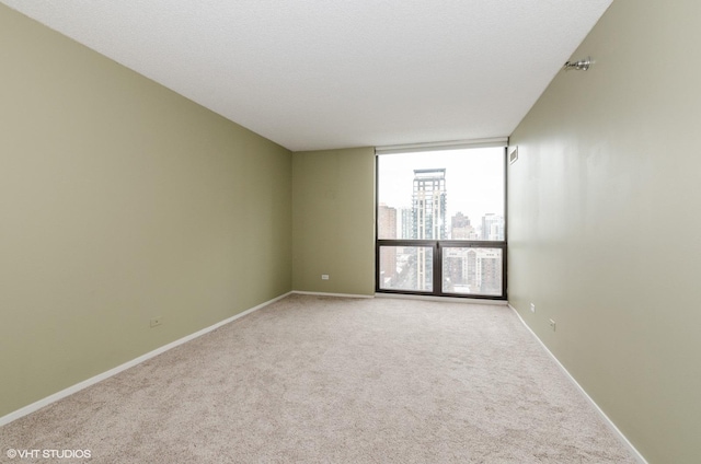 70 W Huron St Unit 2202, Chicago, IL 60654 - spare room with carpet flooring, a view of city, and floor to ceiling windows
