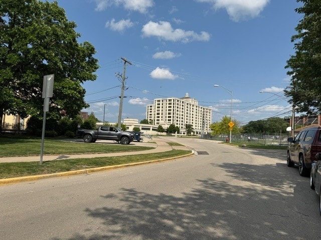 825 Pearson St Unit 3A, Des Plaines, IL 60016 - view of asphalt road with traffic signs, sidewalks, street lighting, and curbs