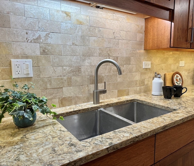 825 Pearson St Unit 3A, Des Plaines, IL 60016 - kitchen view of light stone counters, decorative backsplash, and brown cabinetry
