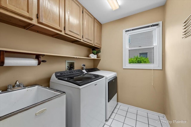 200 Ambria Dr, Mundelein, IL 60060 - laundry area featuring cabinet space, washing machine and clothes dryer, and light tile patterned floors