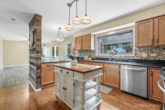 200 Ambria Dr, Mundelein, IL 60060 - kitchen featuring dishwasher, tasteful backsplash, dark countertops, and light wood-type flooring