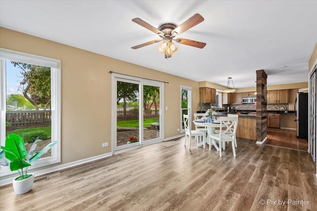 200 Ambria Dr, Mundelein, IL 60060 - dining area with healthy amount of natural light, dark wood finished floors, and a ceiling fan