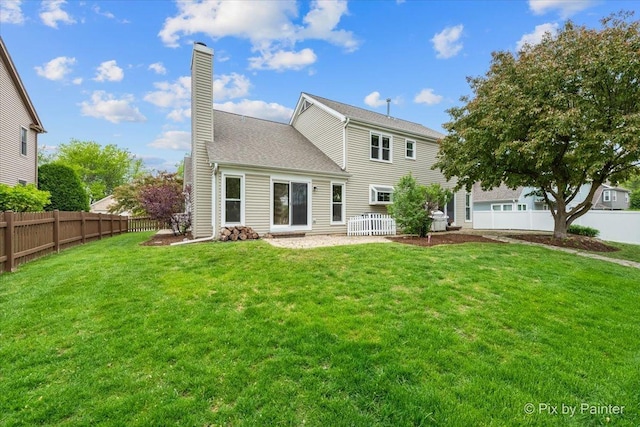 200 Ambria Dr, Mundelein, IL 60060 - rear view of property featuring a chimney, a fenced backyard, and a shingled roof