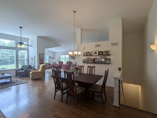 1471 Baroque Ave, Volo, IL 60073 - dining room featuring dark wood-style flooring, a chandelier, high vaulted ceiling, and ceiling fan