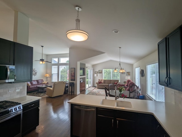 1471 Baroque Ave, Volo, IL 60073 - kitchen with appliances with stainless steel finishes, open floor plan, a peninsula, light countertops, and lofted ceiling